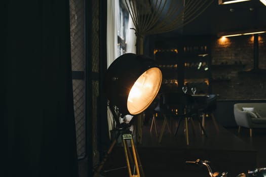Loft dark interior. Vintage light source lamp.