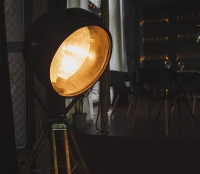 Vintage large lamp in the apartment. brutal loft interior
