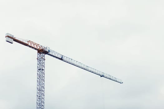 hoisting crane on sky background. construction site