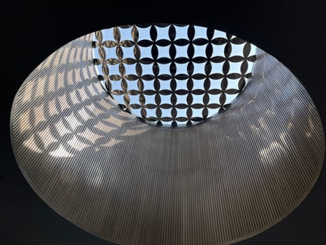 Interesting and unique artistic building roof pattern and texture for backgrounds against blue sky