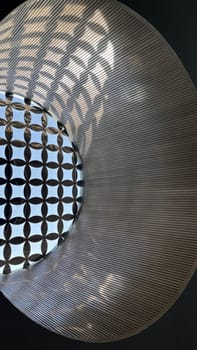 Interesting and unique artistic building roof pattern and texture for backgrounds against blue sky