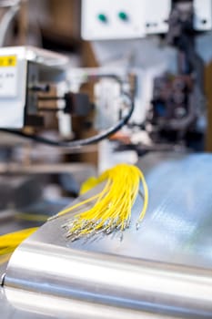 Manufacturing. Close-up of crimped wires on machine