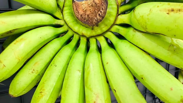 very fresh and ripe delicious banana cluster or banana hand or a bunch of bananas fruit healthy diet supermarket product