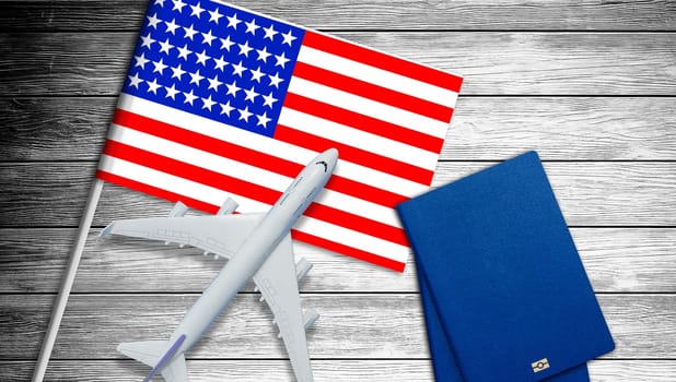 Plastic toy jet plane and flag of USA. American flag and grey toy air plane on wood close up. Flight to USA. High quality photo