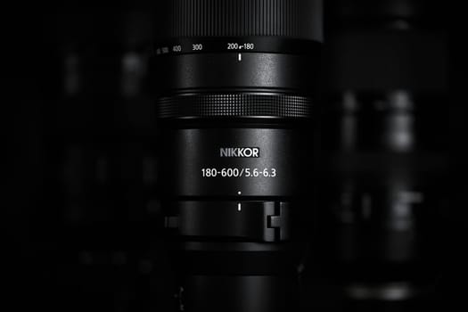 Super telephoto lenses on a blurred background. The NIKKOR Z 180-600mm f 5.6-6.3 VR in the foreground. Professional photo and video optical lenses for digital camera. 20.02.2024, Yerevan, Armenia.