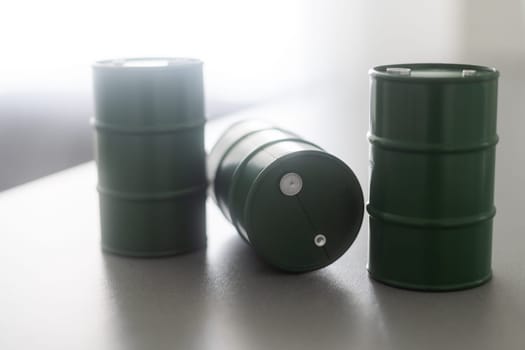 models of barrels with oil on the table.