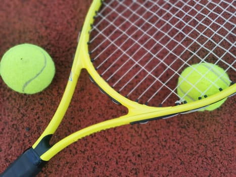 tennis racket with a tennis ball on a tennis court. High quality photo