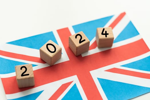 2024, United Kingdom, United Kingdom flag with date block, Concept, Important events for UK in the new year, election, economy, social activities, central bank, UK foreign policy. High quality photo
