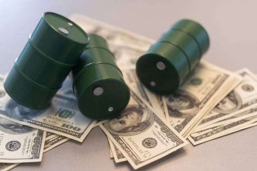 Barrel of crude oil with dollar bills. Close up. Business concept. High quality photo