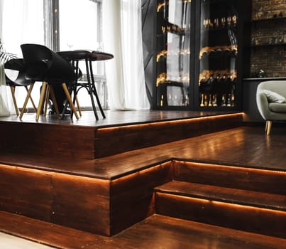 expensive loft style interior with dining area and wine cabinet