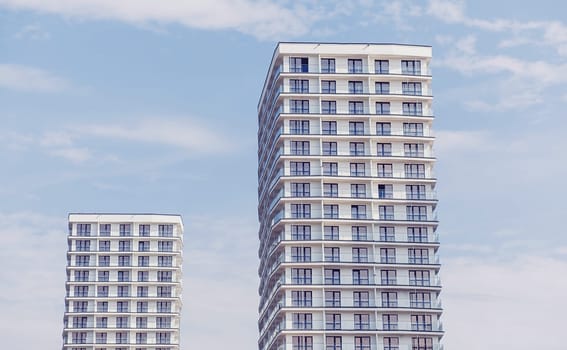 Minsk, Belarus- August 2019: Modern apartment buildings on a sunny day with a blue sky.