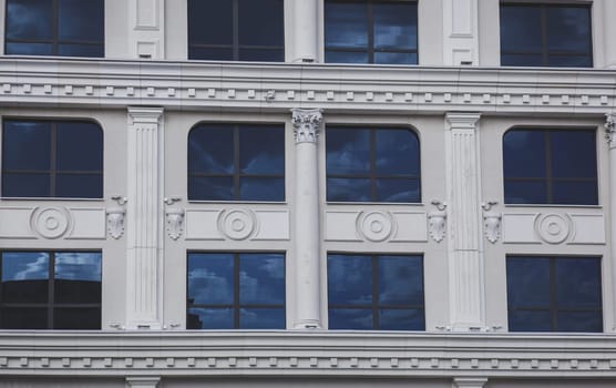 Vintage facade classical building. Columns, stucco and other architectural decoration of the Baroque style 