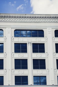 Classic architecture. Exterior windows and walls of old building.