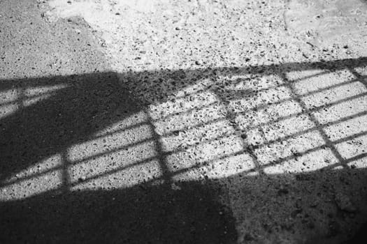 shade from the sun on the pavement. abstract images