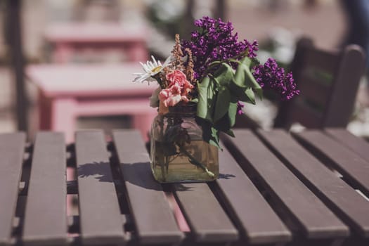 Tables of a european outdoor cafe decorated
