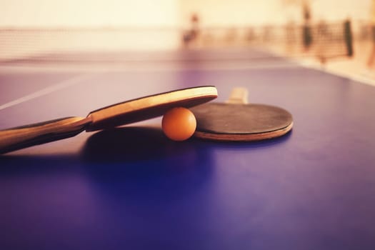 two table tennis racket with ball