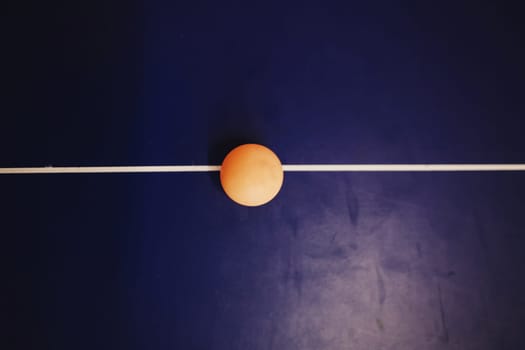 table tennis ball on blue table 
