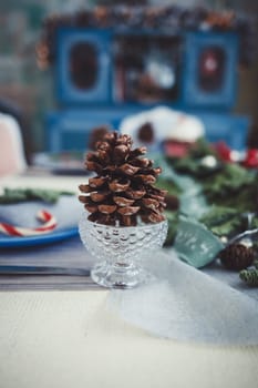 the decoration of the Christmas table. glass with a cone