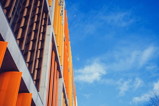 multicolored modern building against the blue sky in Riga