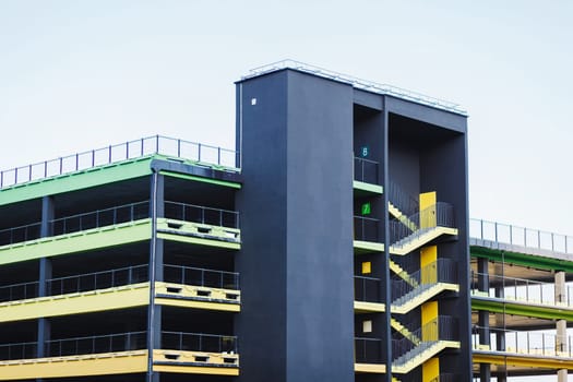  stair on the side of a colorful multi storey parking lots building