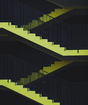 emergency exit. yellow stairs of the parking lot