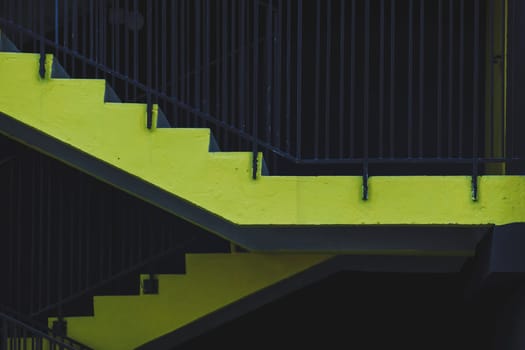 yellow concrete stairs in an urban environment