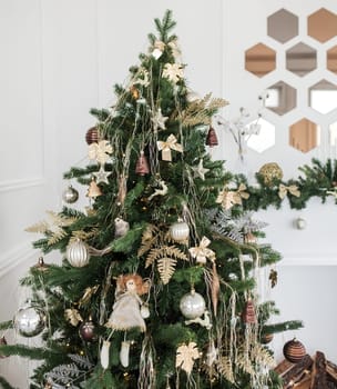beautiful christmas tree decorated with baubles and many different presents