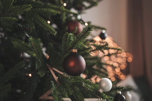 Christmas decorations on the branches of a fir tree in the new year