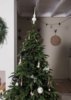 Decorated Christmas tree with balls and presents for new year 