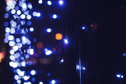 Blue city lights blurred bokeh background. Christmas season