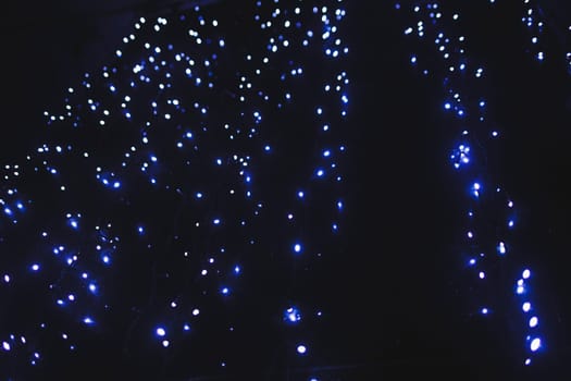 blue lights in the night city. Christmas
