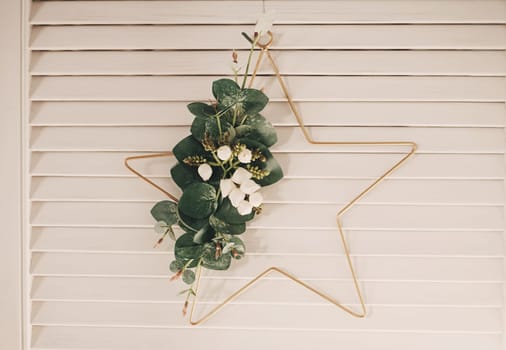 Christmas star hanging on a wooden wall