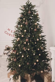 Merry Christmas and Happy Holidays. Decoration the Christmas tree indoors.