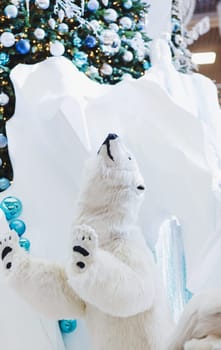 big toy polar bear on the background of Christmas decorations