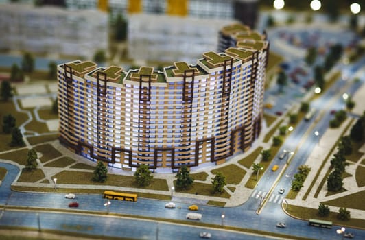 modern building in miniature. mini road with small cars