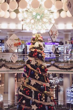 Minsk, Belarus-December 2019: Christmas tree in the interior of a luxury shopping center.