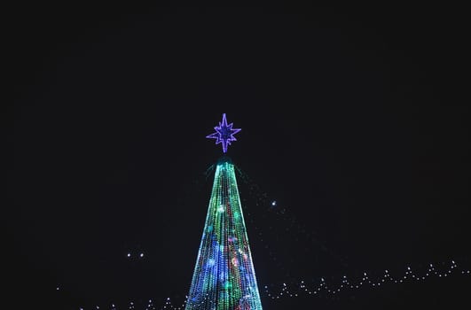 Christmas tree,evening street in night city