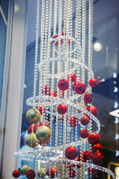 Christmas decoration of shop windows with hanging balls