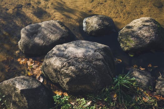 stones lie on the water. autumn landscape