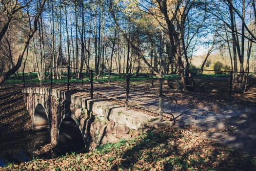 old bridge in the autumn Park of Europe
