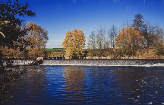 autumn Park with waterfall and lakes. eco landscape