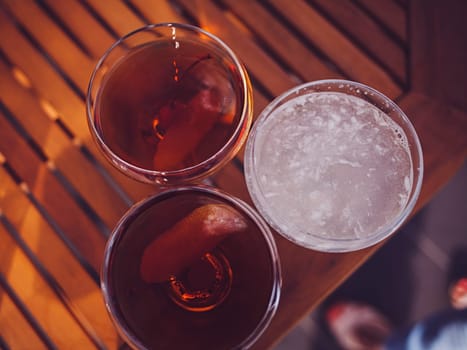 three alcoholic cocktails on the table. the view from the top