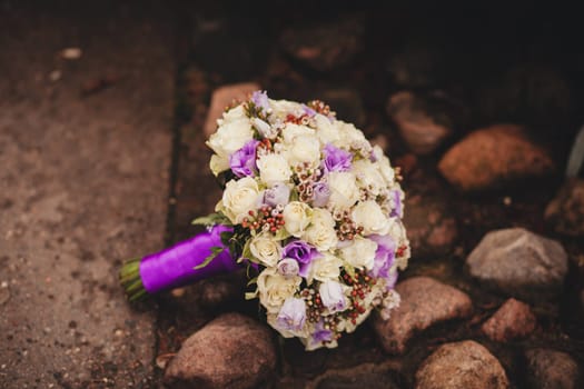 Wedding bouquet. The bride's bouquet. Bouquet of blue flowers with ribbon
