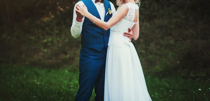 happy couple hugging on the outdoors to the wedding day. bride and groom