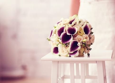 wedding bouquet of the bride lies on a chair. copy space