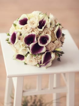 close-up of a wedding bouquet on a chair
