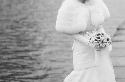 black and white portrait of the bride with a wedding bouquet