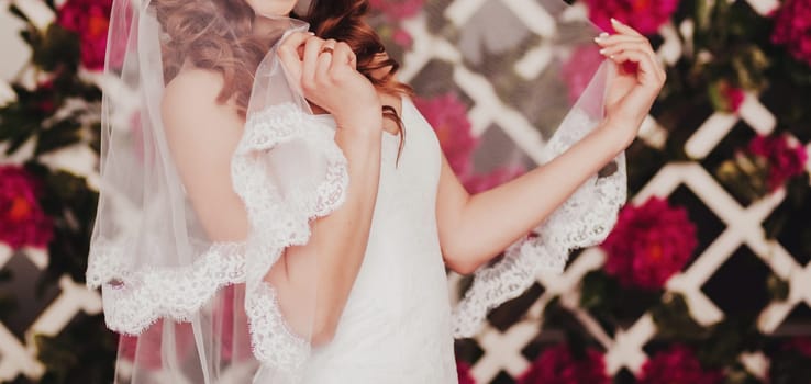 portrait of the bride with a veil in the interior. wedding concept