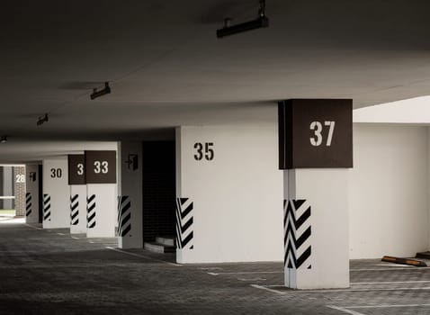 interior of a garage with free parking in the parking lot building. parking with numbers