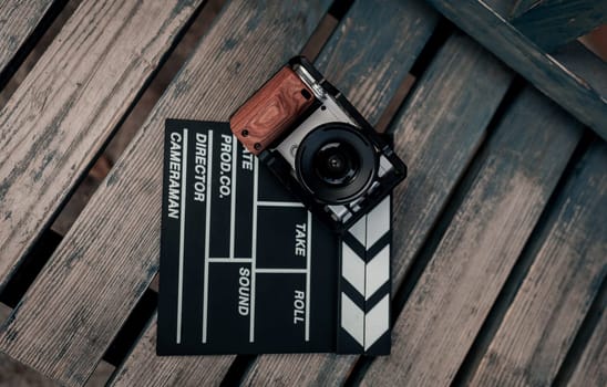 camera and video production equipment on wooden background